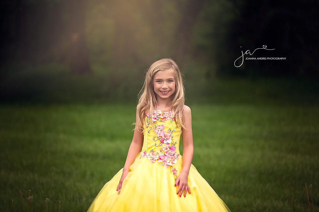 Gorgeous Girl in a yellow gown with pink flowers