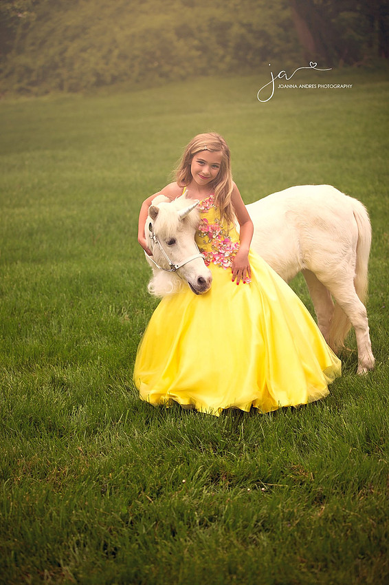 Girl hugging unicorn