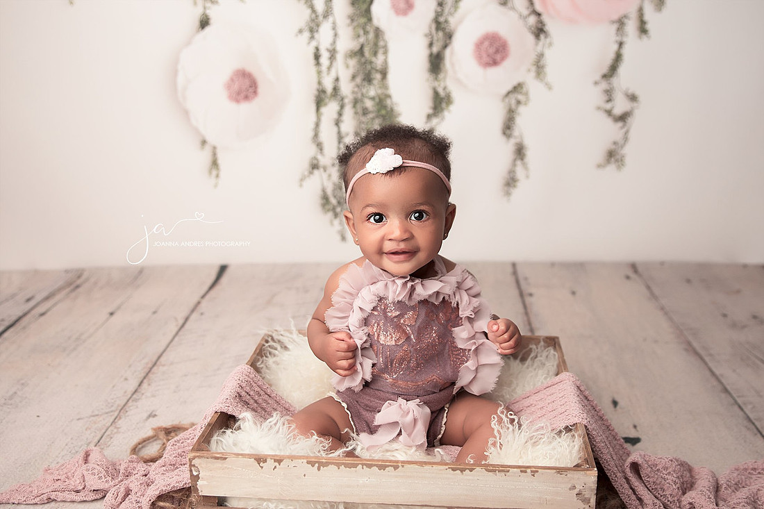 Baby in prop smiling