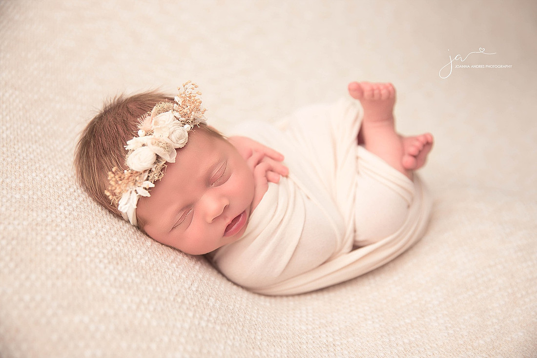 Baby Girl wrapped in neutrals