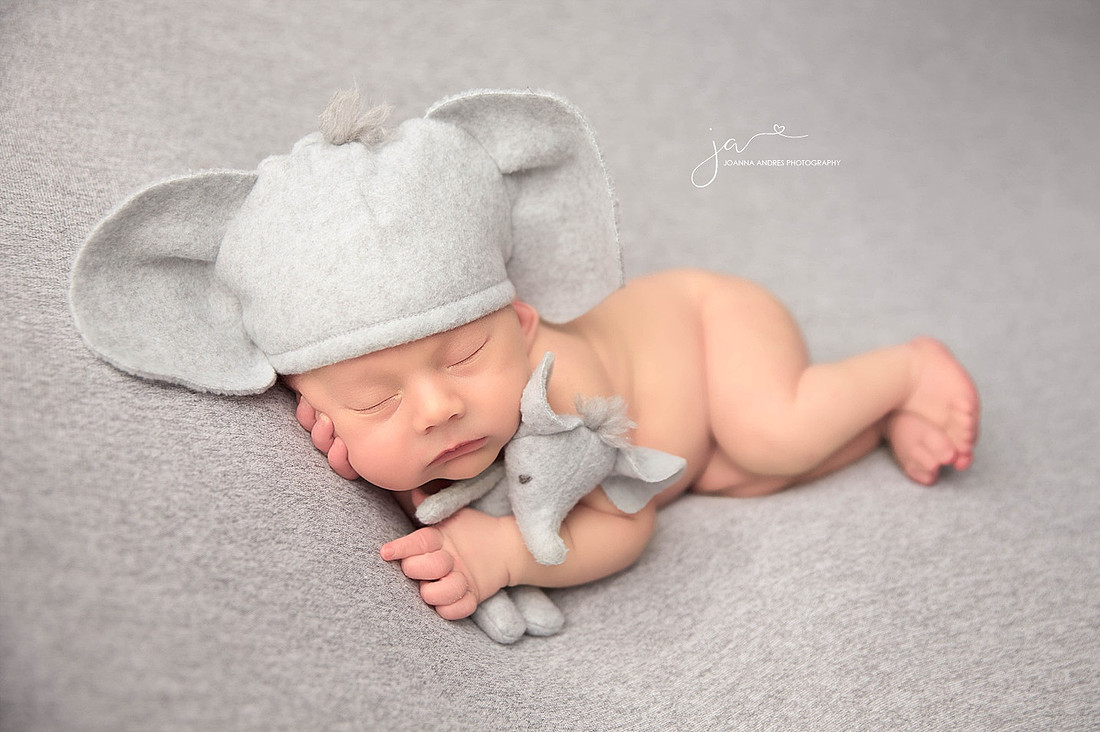 Baby Boy Side Laying Pose with Elephant Hat and Lovey