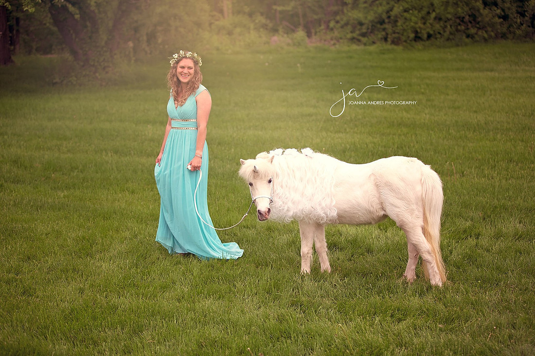 Lady in Blue Dress walking with a unicorn