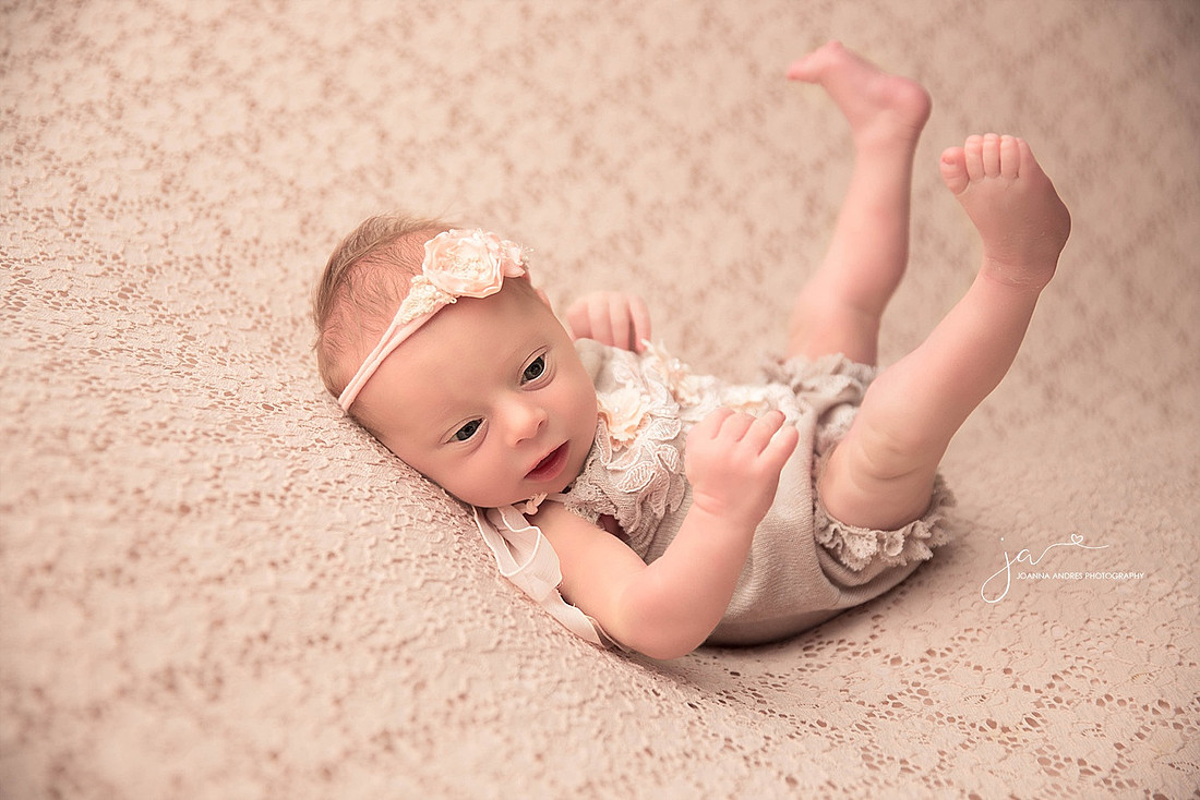 Baby with legs up