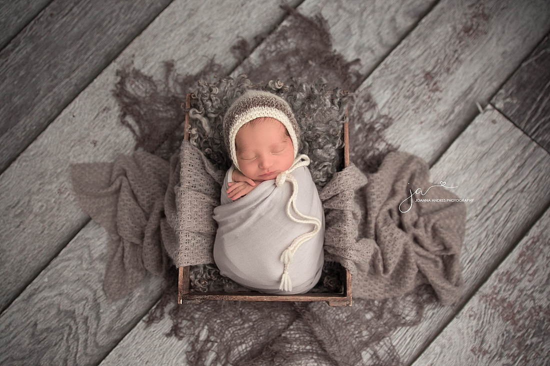 Baby Boy in Basket with gray wraps