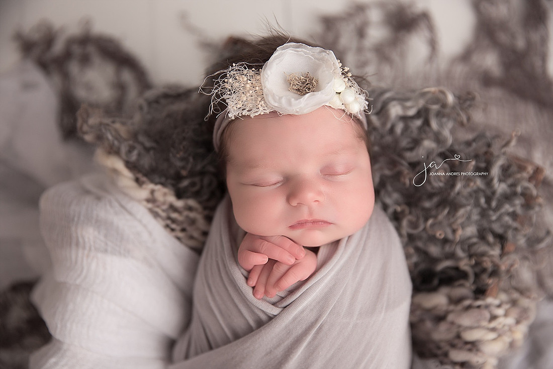 Baby wrapped in Gray with White Headband