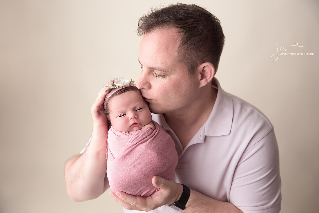 Dad Kissing Baby