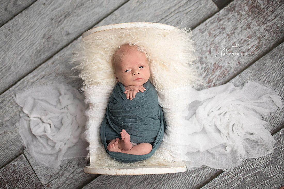 Baby Boy in Prop with White Fluff and Blue Wrap