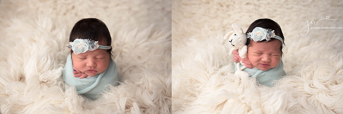 Baby In White Flokati and Light Blue Wrap