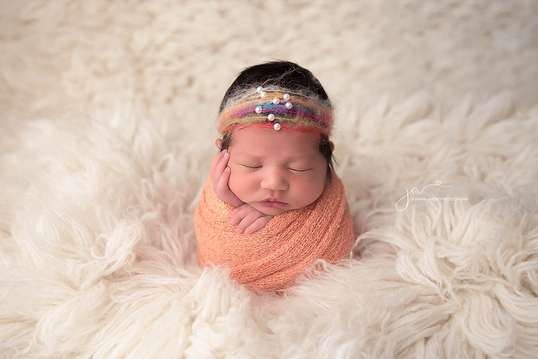 Baby Wrapped in Orange with Rainbow headband