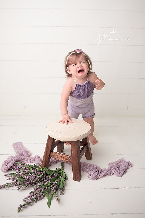 Baby Crying Standing next to stool