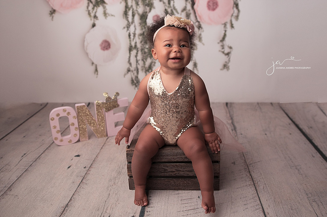 Baby girl wearing gold sequence and pinks