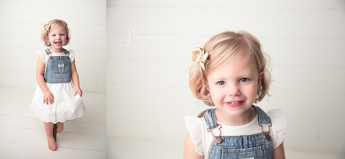 Sweet little 2 year Old girl wit bibs on