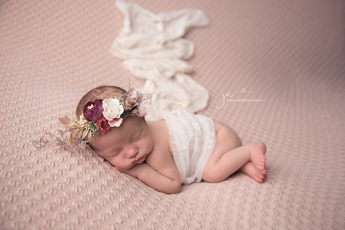 Side laying Pose with Baby Girl with beautiful headpeace and lace wrap