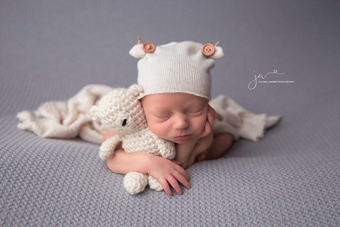 Froggy Pose holding Bear Lovey