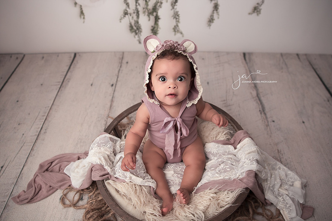 Baby Girl with hoodie looking up