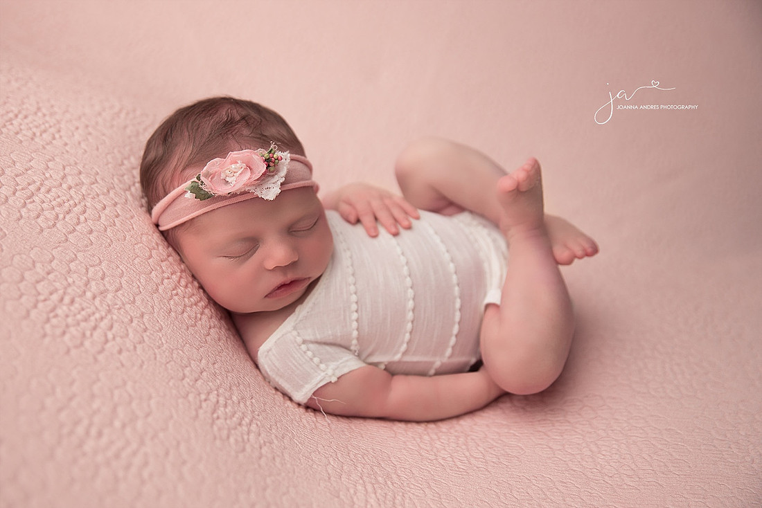 Baby Huck Fin Pose wearing white romper