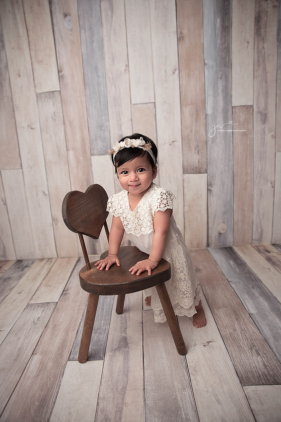 Baby Leaning on chair