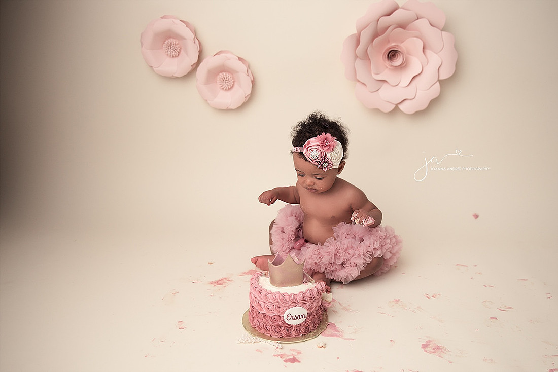 Baby GIrl looking at cake