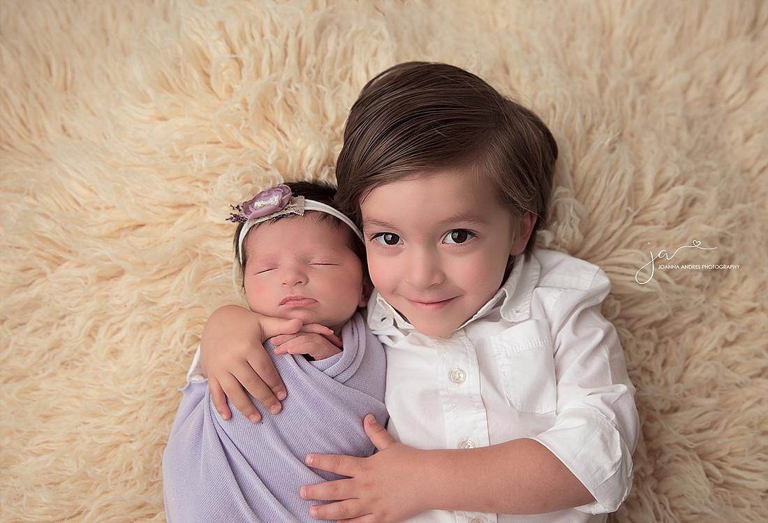 Sibling Photo with baby girl in purples and Proud Big Brother Smiling