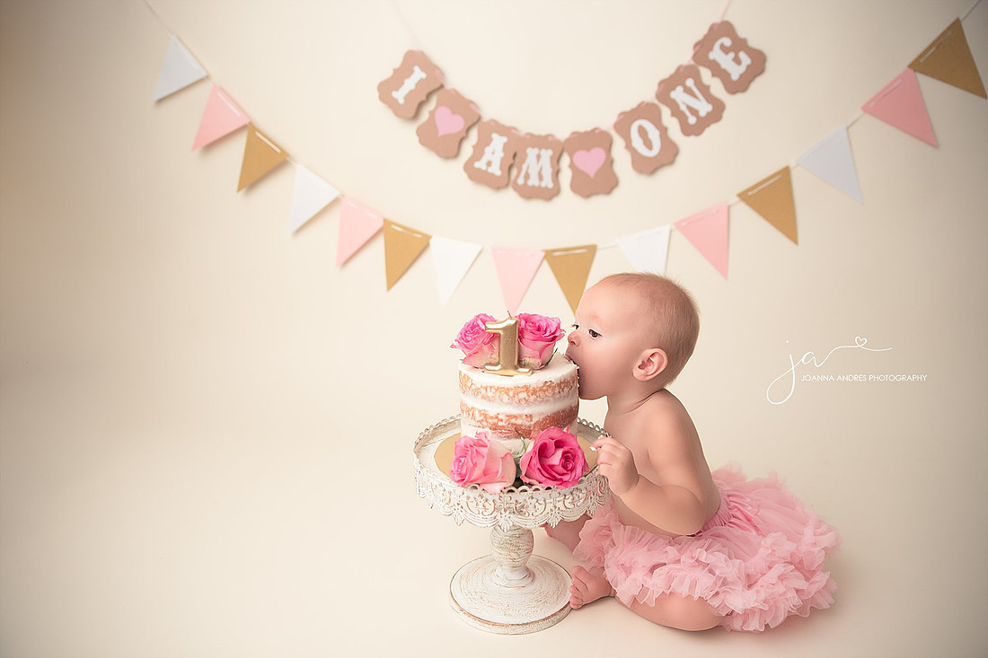 Baby Taking bite of cake without her hands