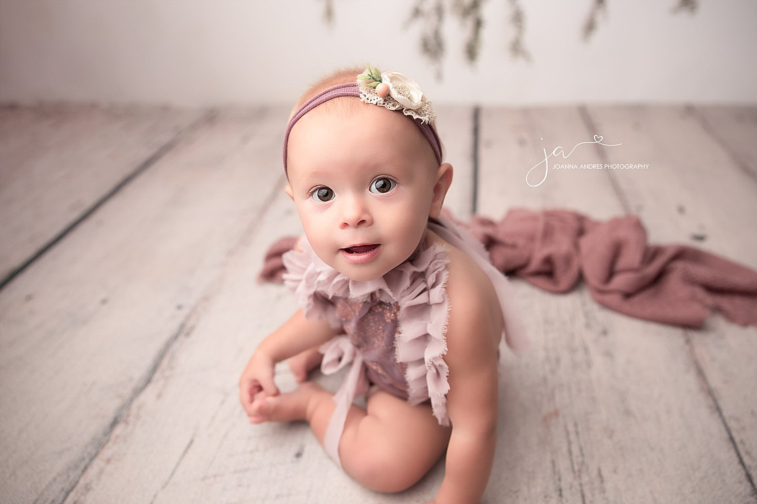 Baby Crawling toward the camera and smiling