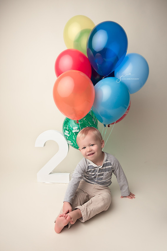 2 year old with baloons