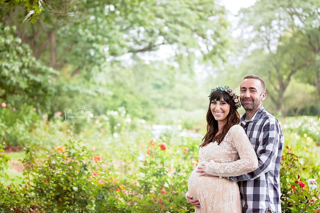 Materntiy Session with Couple with Rose Garden as backdrop