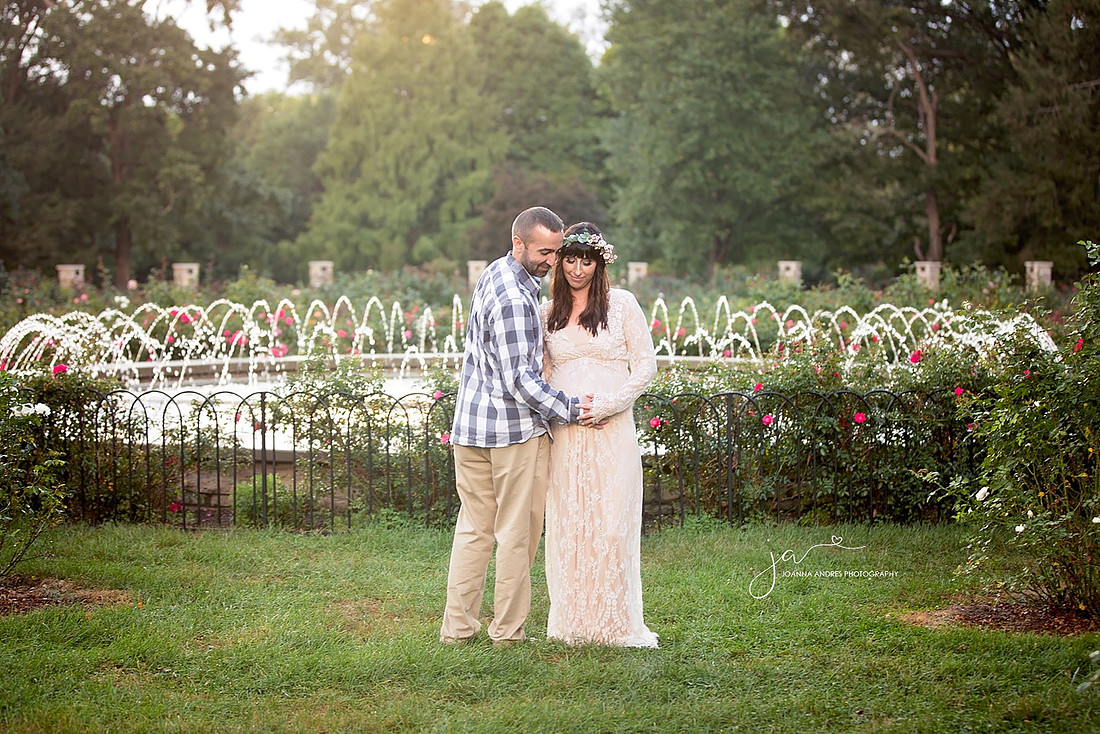 Maternity Session with Couple and water fountain in backdrop