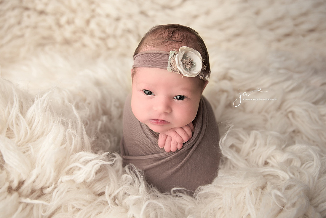 Baby Wrapped in Neutral with White Flokati Rug