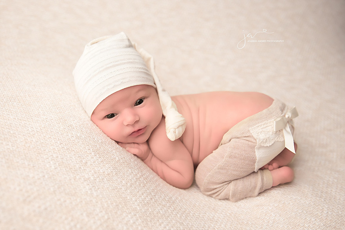 Baby girl wide awake in bum up position