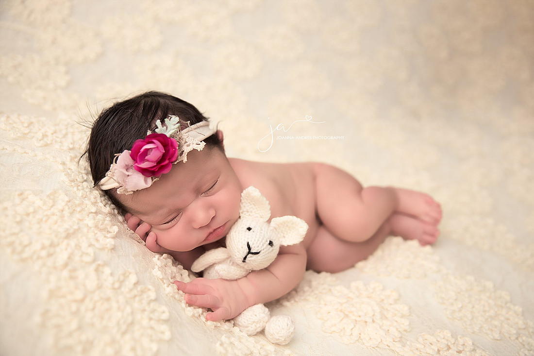 Side Laying Pose Holding Bunny