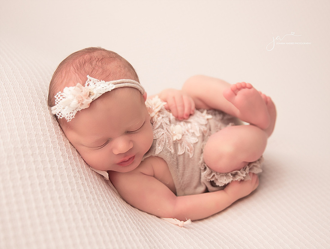 Baby Girl in Neutrals in Huck Finn Pose