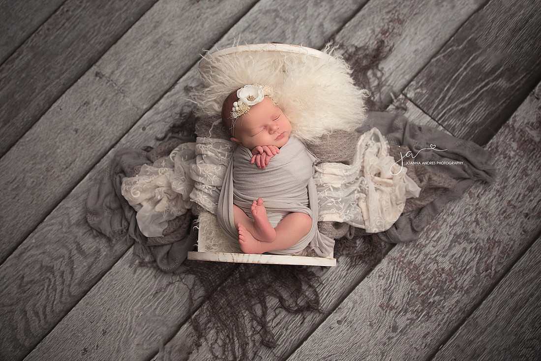 Baby in Prop with Grey Backrops