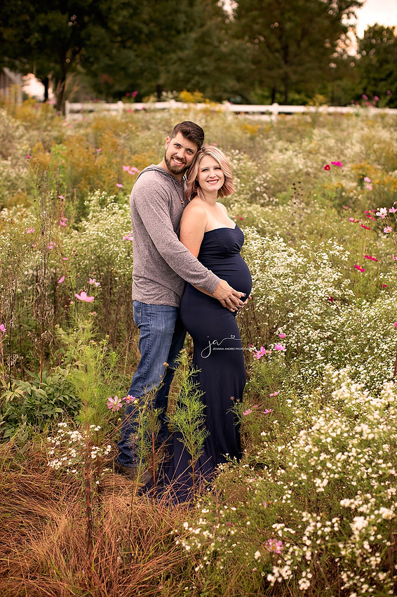 Materntiy Photo with Couple in a field of wild flowers
