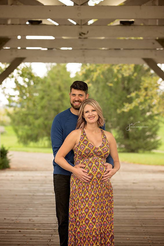 Materntiy Photo of Couple on a bridge